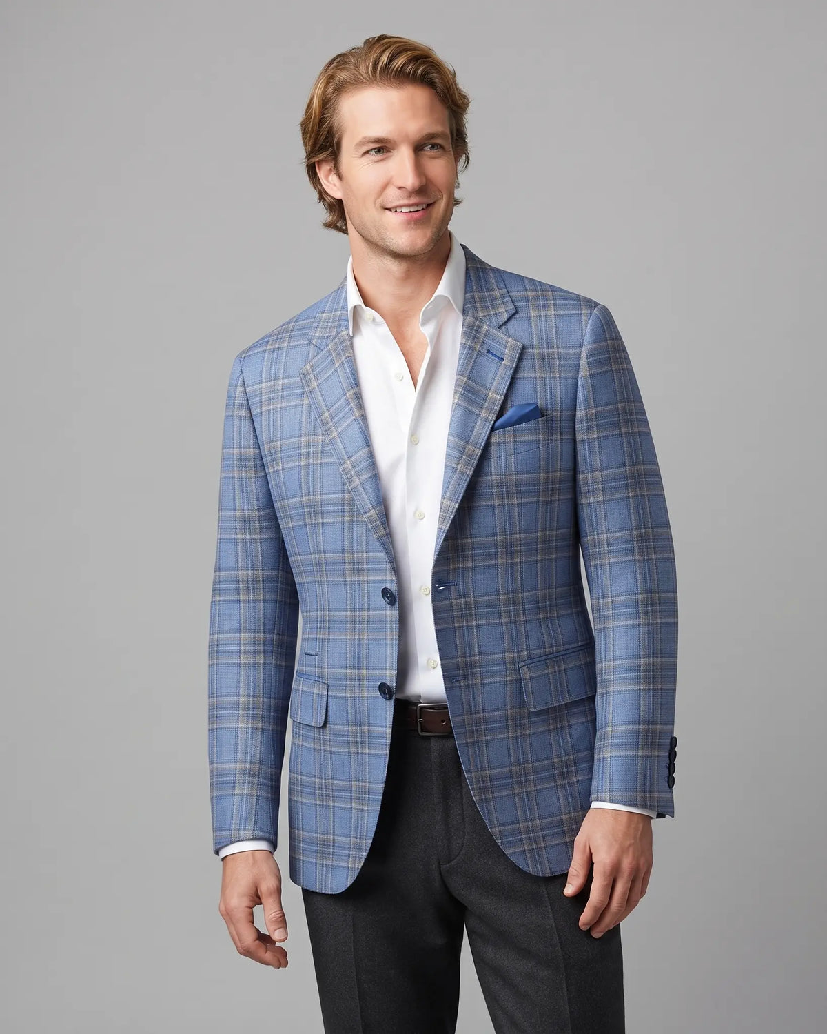 Side model view of Powder Blue with Tan Windowpane Plaid men's sport coat showing the jacket worn at an angle