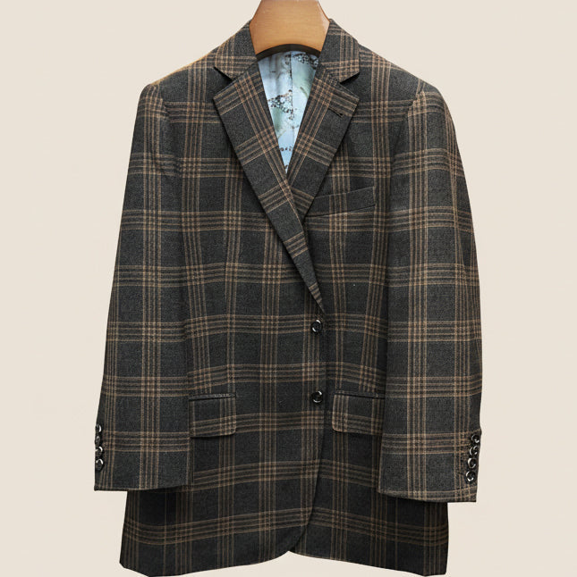 Front button panel of brown rust block windowpane sport coat featuring walnut dark brown and amber horn buttons