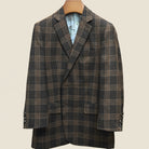 Close-up view of brown rust block windowpane sport coat showing hand-sewn Milanese buttonhole with detailed stitching on lapel