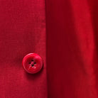 Horn buttons adding a natural, refined touch on a scarlet red, solid plain color suit.