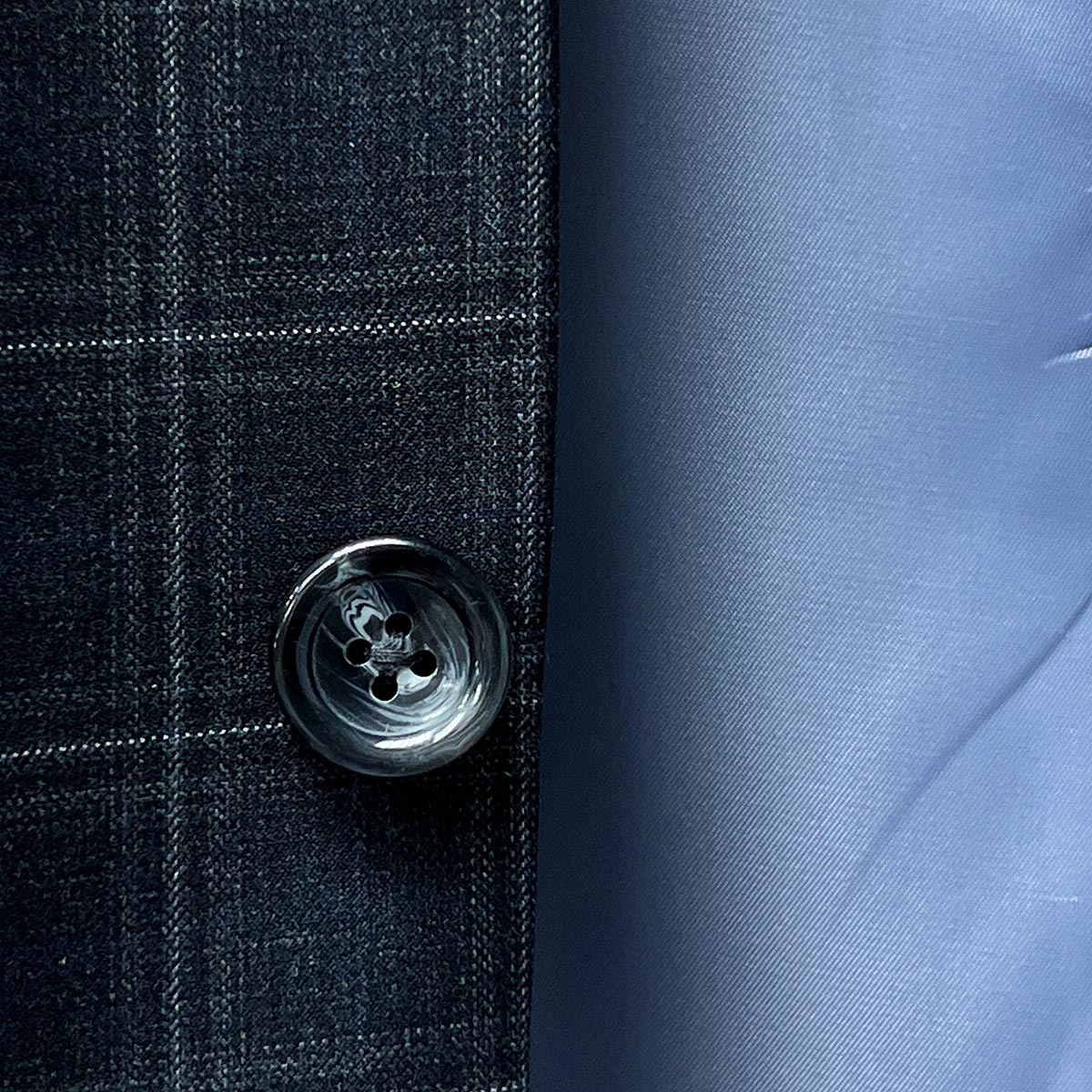 Horn buttons feature on Westwood Hart Grey Plaid Windowpane Men's 3pc Suit, Silk Bemberg Sky Blue Lining