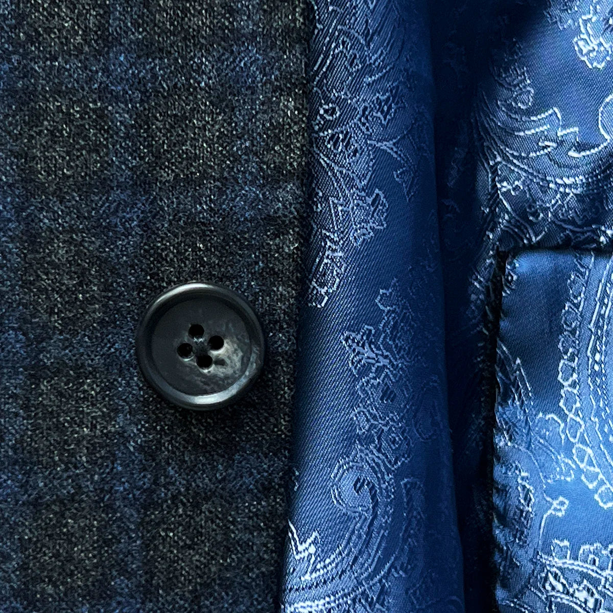Horn marble buttons on a grey blue grid check flannel sportcoat.