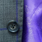 Horn marble buttons on a grey purple windowpane sportcoat.