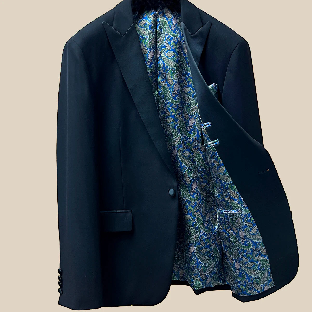 Inside view of the right side of a black tuxedo suit dinner jacket showcasing inner craftsmanship.