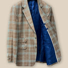 Inside left view showing inner pockets of a brown beige men's sport coat with blanched almond and midnight blue windowpane pattern.