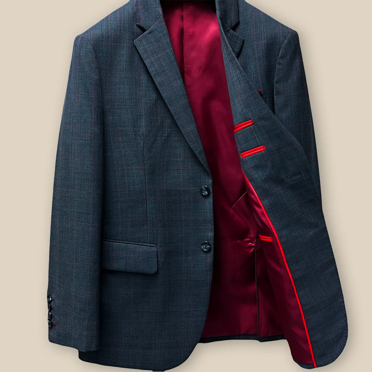 Inside jacket left view showcasing the lining and structure on a charcoal grey prince of wales plaid with maroon windowpane suit.