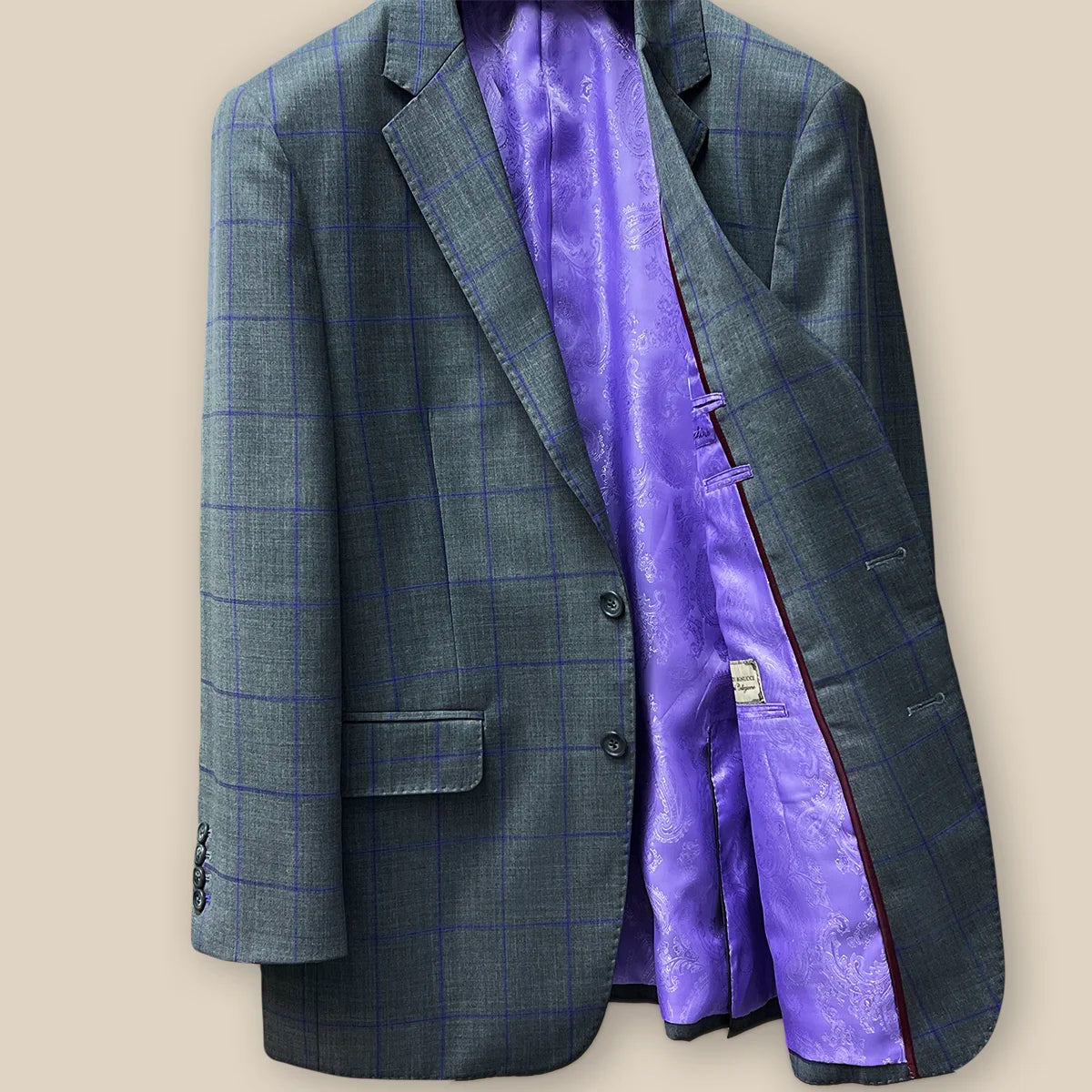 Left inside view of a grey purple windowpane sportcoat.