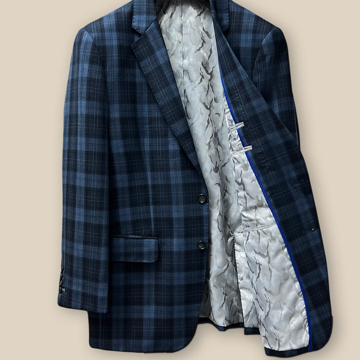 Left view inside a Prussian Blue sportcoat with camouflage grey flash lining.