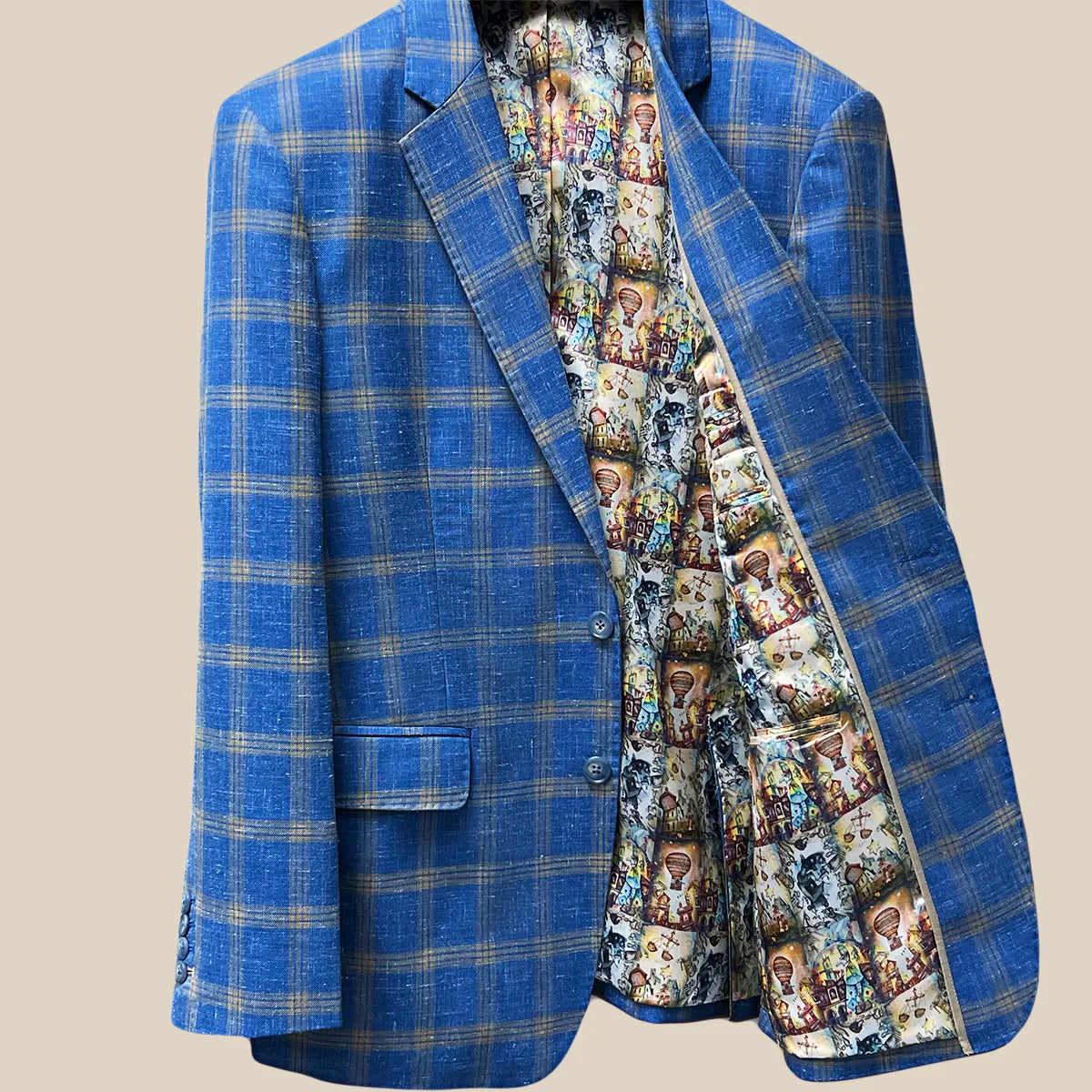 Inside left view revealing the craftsmanship of a sky blue with tan windowpane men's sport coat.