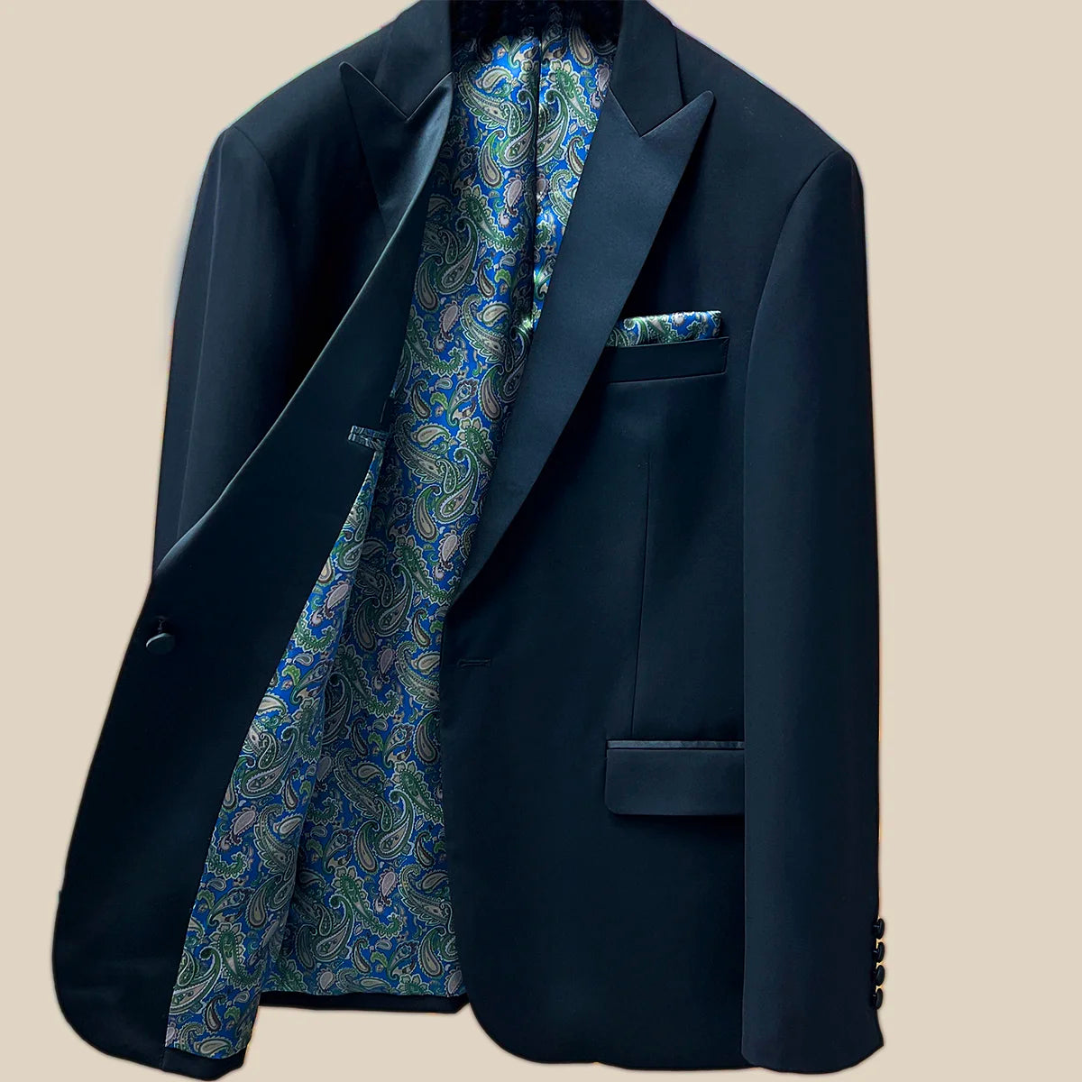 Inside view of the right side of a black tuxedo suit dinner jacket showcasing inner craftsmanship.