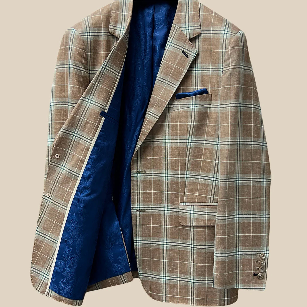 Inside right view showcasing lining quality of a brown beige men's sport coat with blanched almond and midnight blue windowpane pattern.