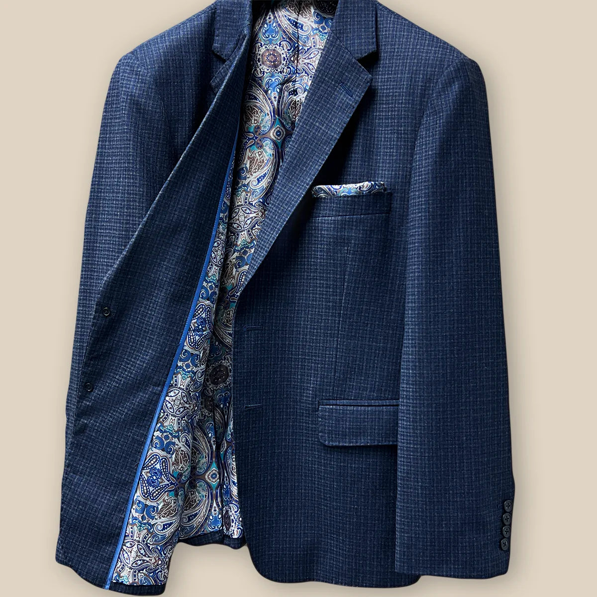 Inside right view showcasing the inner craftsmanship of a gray blue mini grid checks sport coat made of flannel wool.