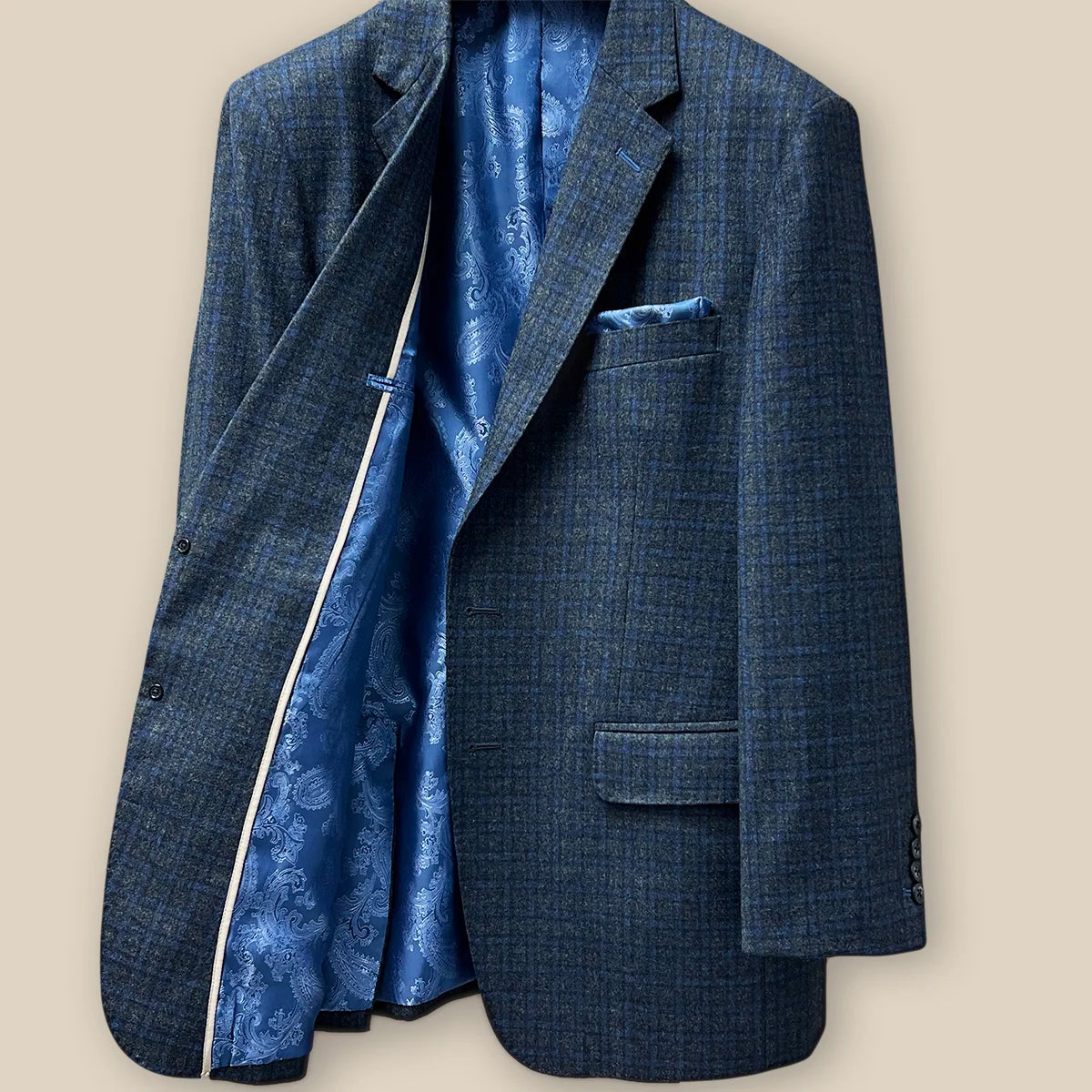 Right interior view of a grey blue grid check flannel sportcoat.