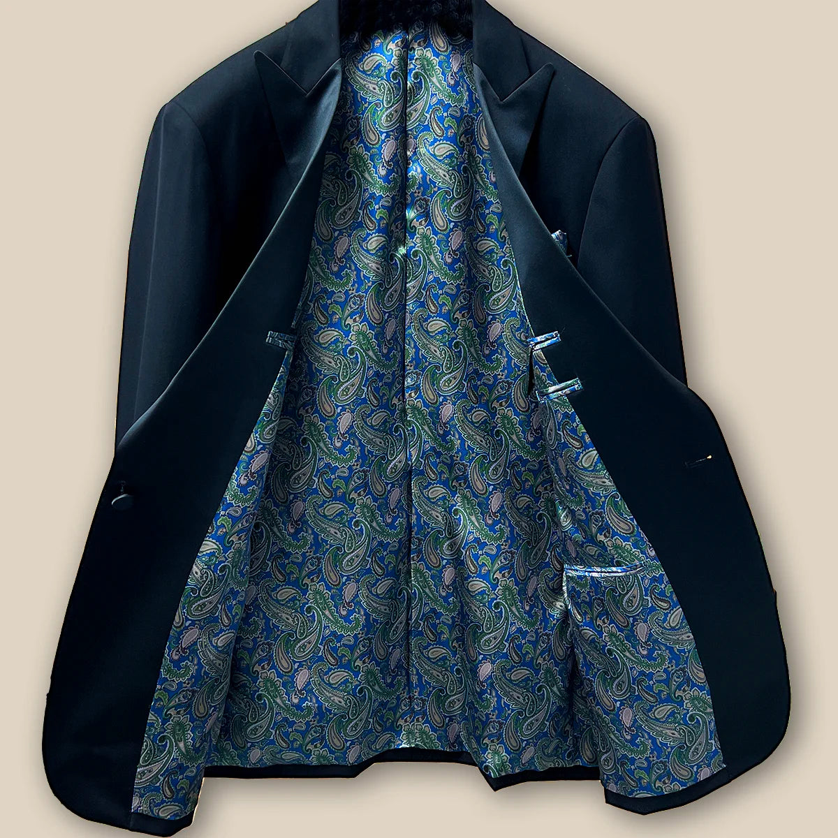 Inside view showcasing the lining and craftsmanship of a black tuxedo suit dinner jacket.