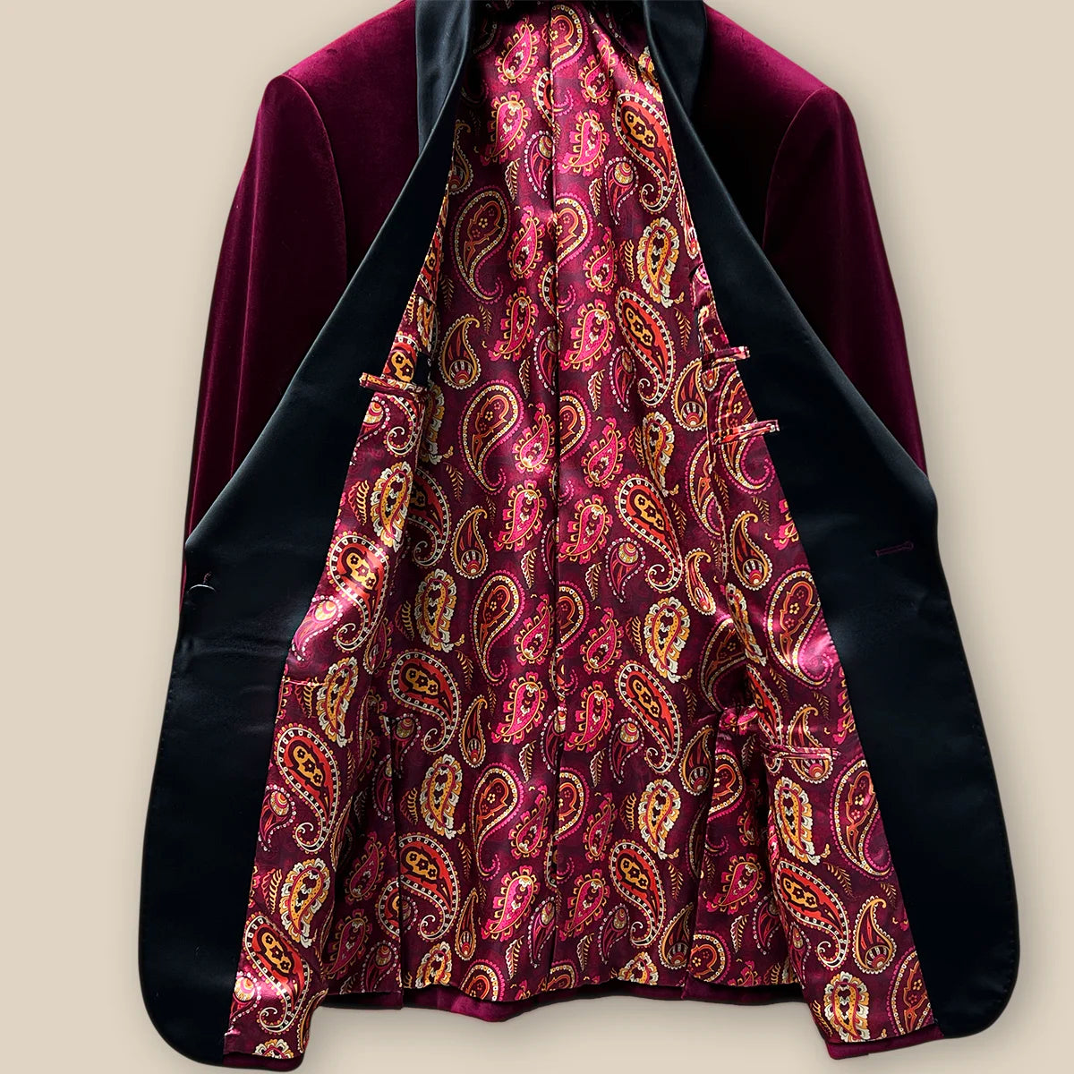 Interior view of a plush burgundy velvet formal jacket.