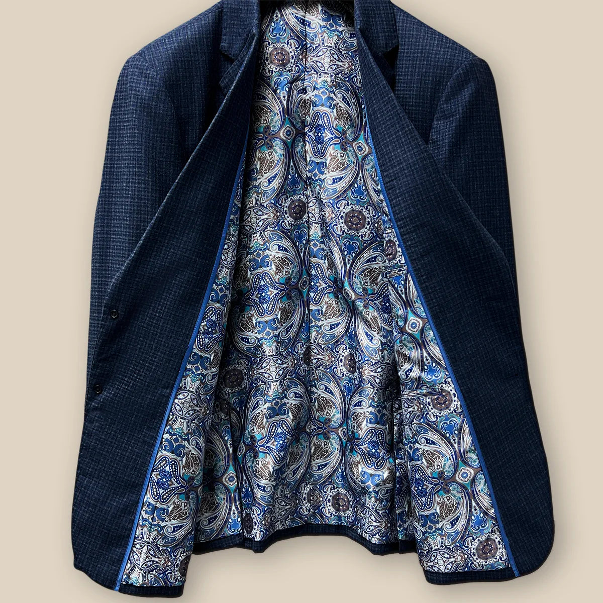 Inside view revealing the workmanship of a gray blue mini grid checks sport coat made of flannel wool.