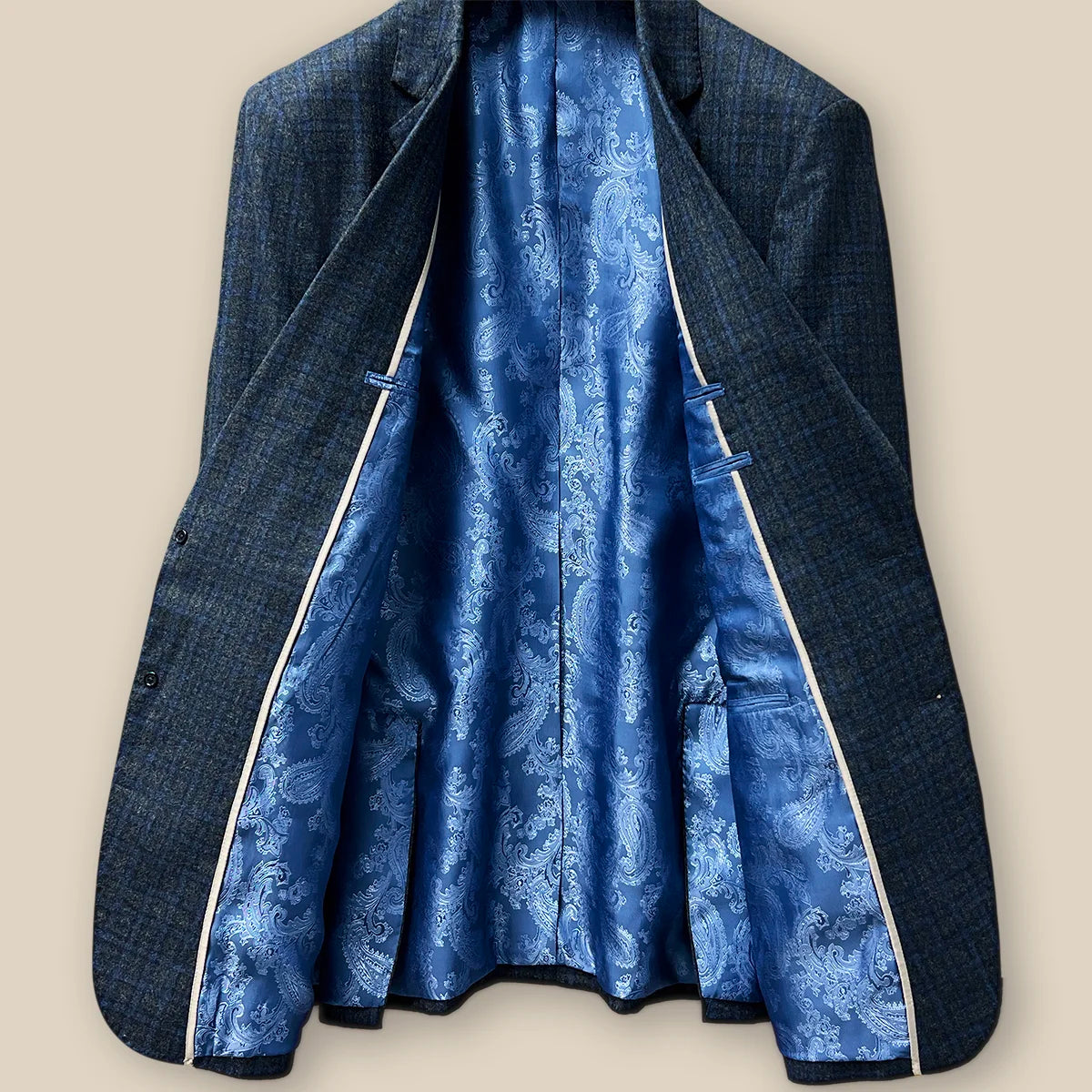 Interior view of a grey blue grid check flannel sportcoat.