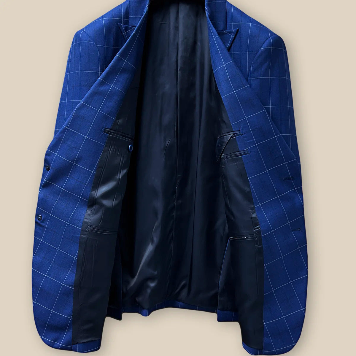 Interior view of a navy blue windowpane suit jacket