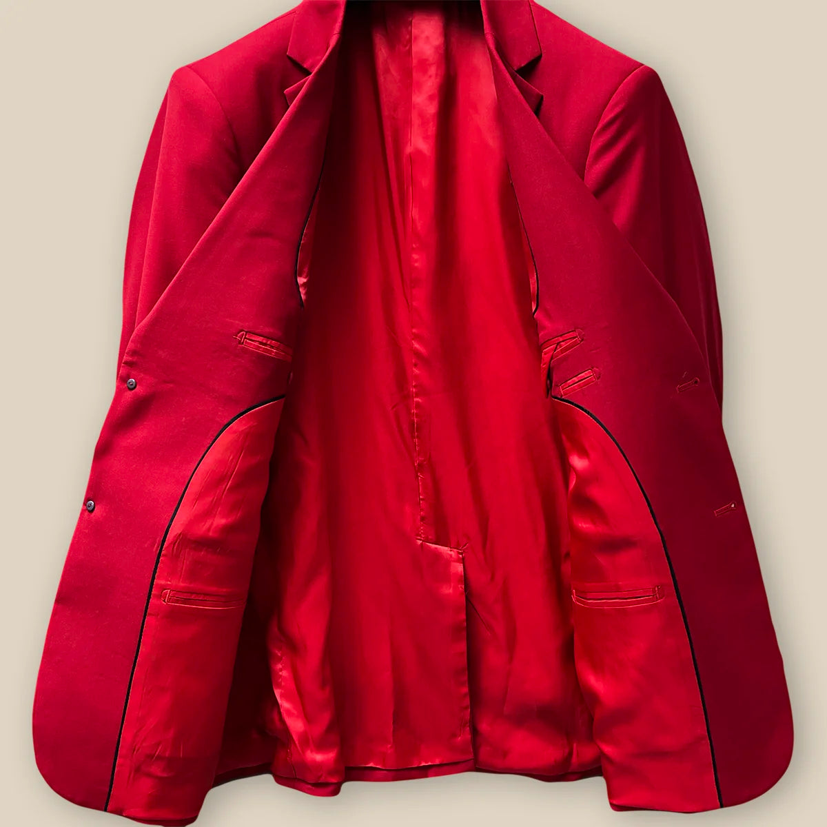 Inside jacket view showing the full interior craftsmanship on a scarlet red, solid plain color suit.