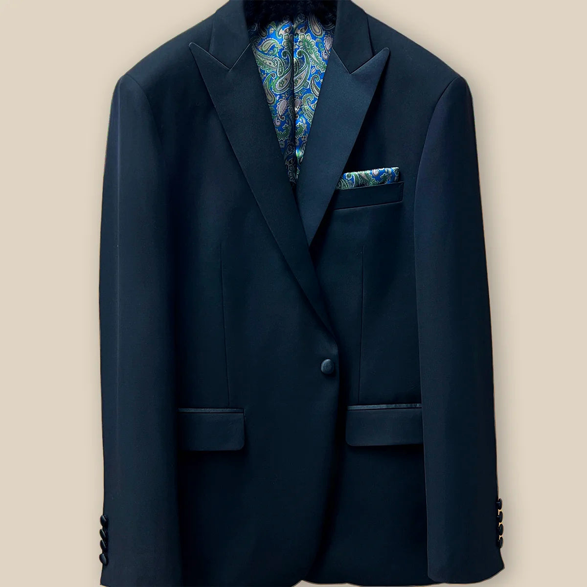 View of the button panel displaying the functional and aesthetic design on a black tuxedo suit dinner jacket.