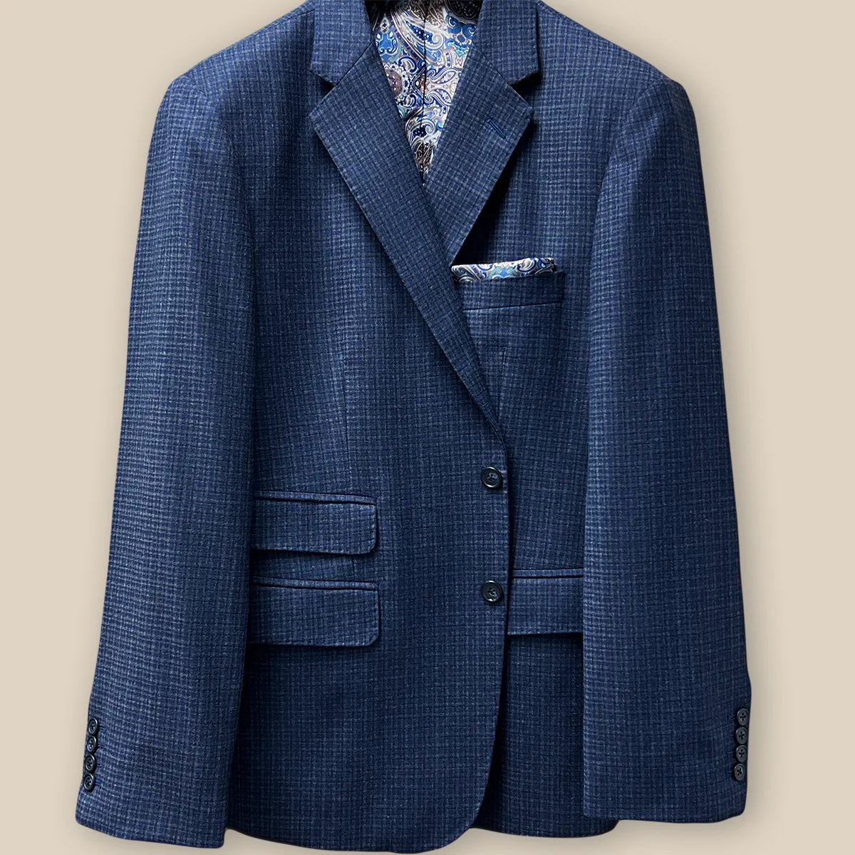 Button panel view showcasing the horn marble buttons on a gray blue mini grid checks sport coat made of flannel wool.