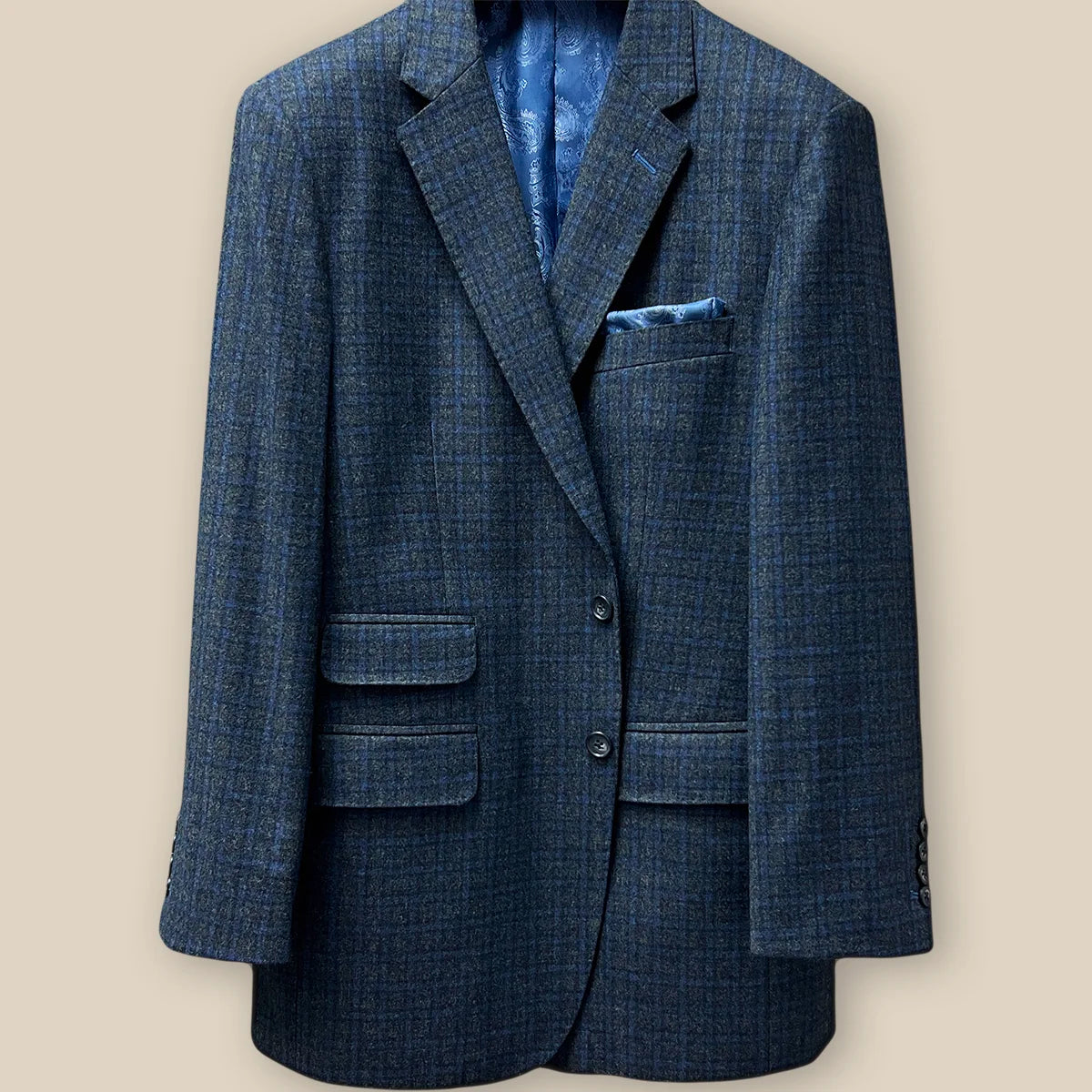 Button panel view on a grey blue grid check flannel sportcoat.