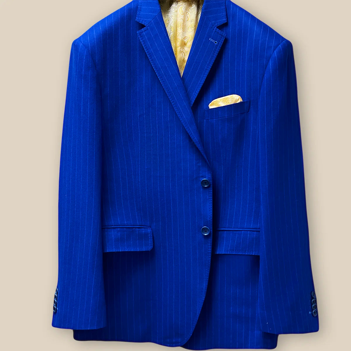 Detailed view of the jacket button panel on the royal blue pinstripe suit.