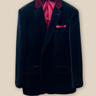 Jacket buttonhole panel view showing the detail work on a black velvet tuxedo suit dinner jacket.
