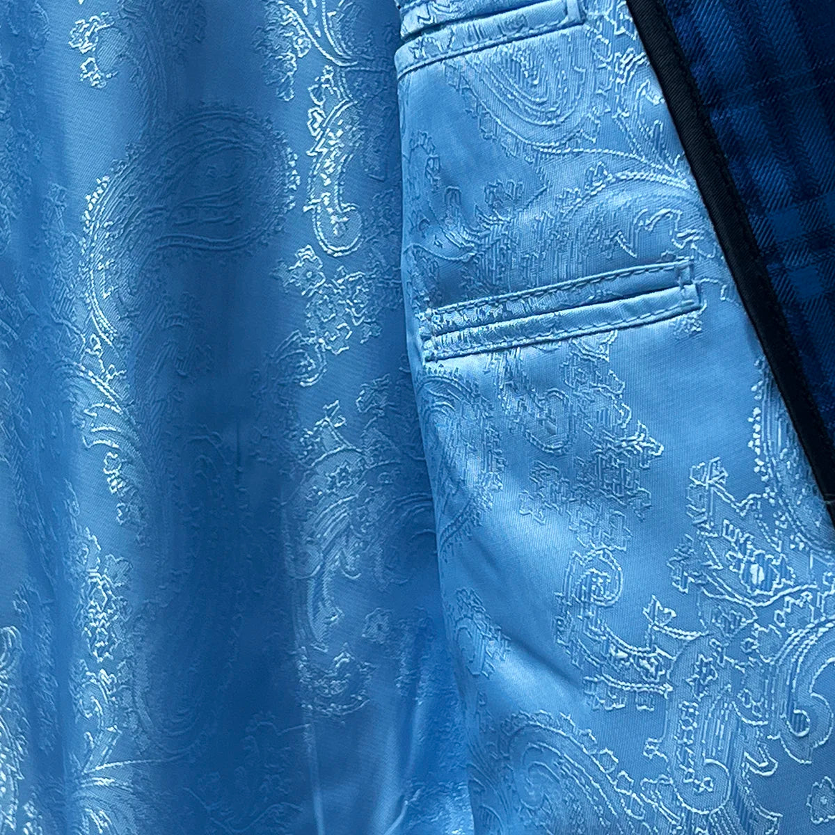 Smooth lining ensuring comfortable wear in a colbalt blue checkered plaid men's sport coat.