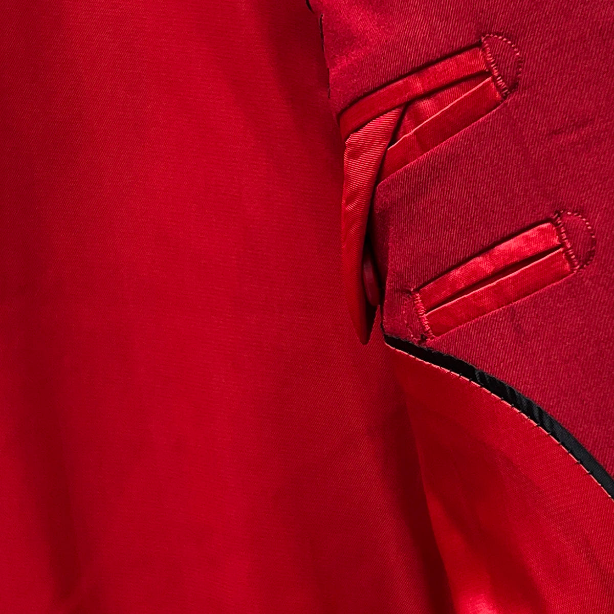 Liner providing additional comfort and a well-tailored fit on a scarlet red, solid plain color suit.