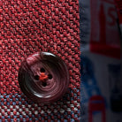 Macro shot of burgundy marble horn buttons showing unique patterns