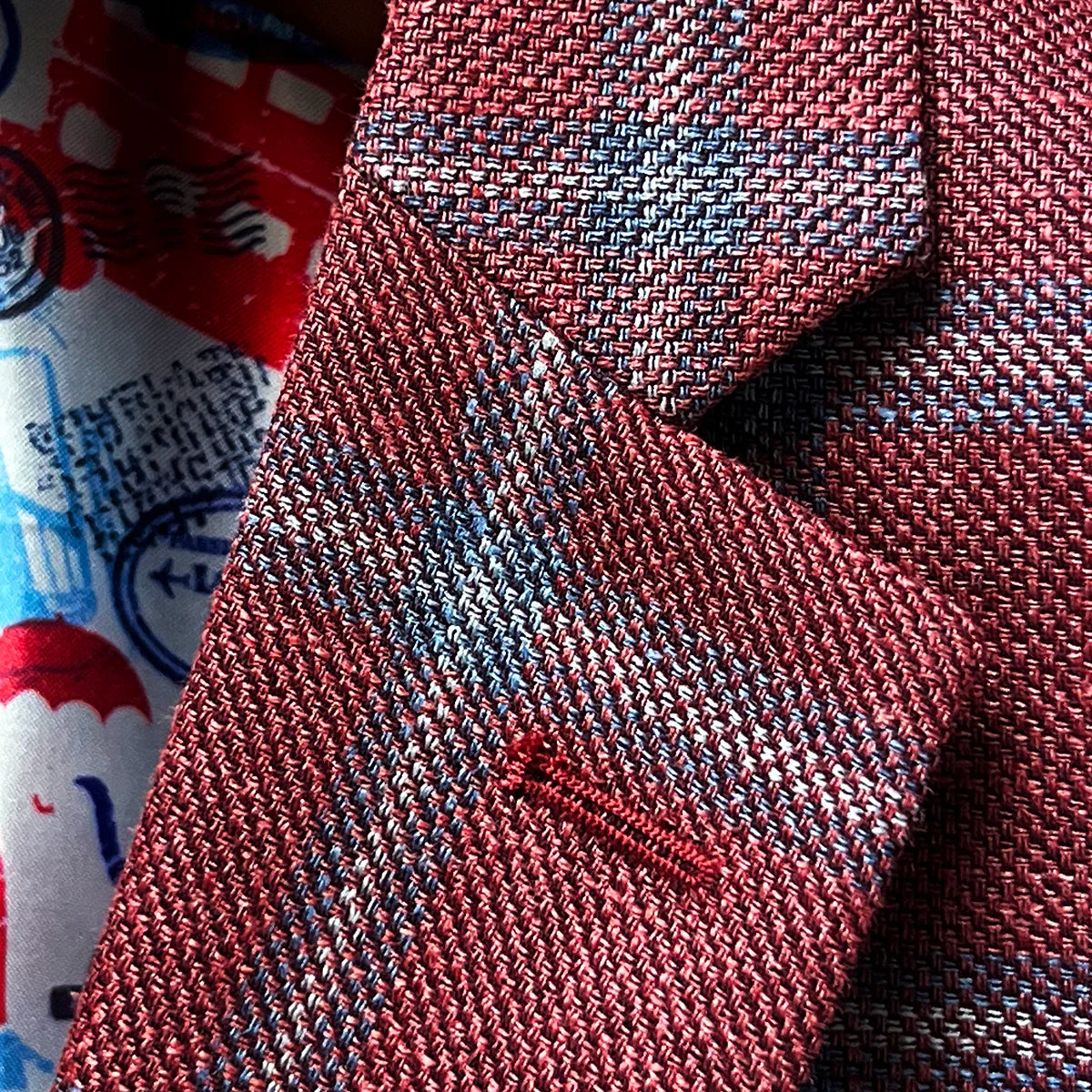 Close-up of notch lapel construction showing fabric pattern alignment