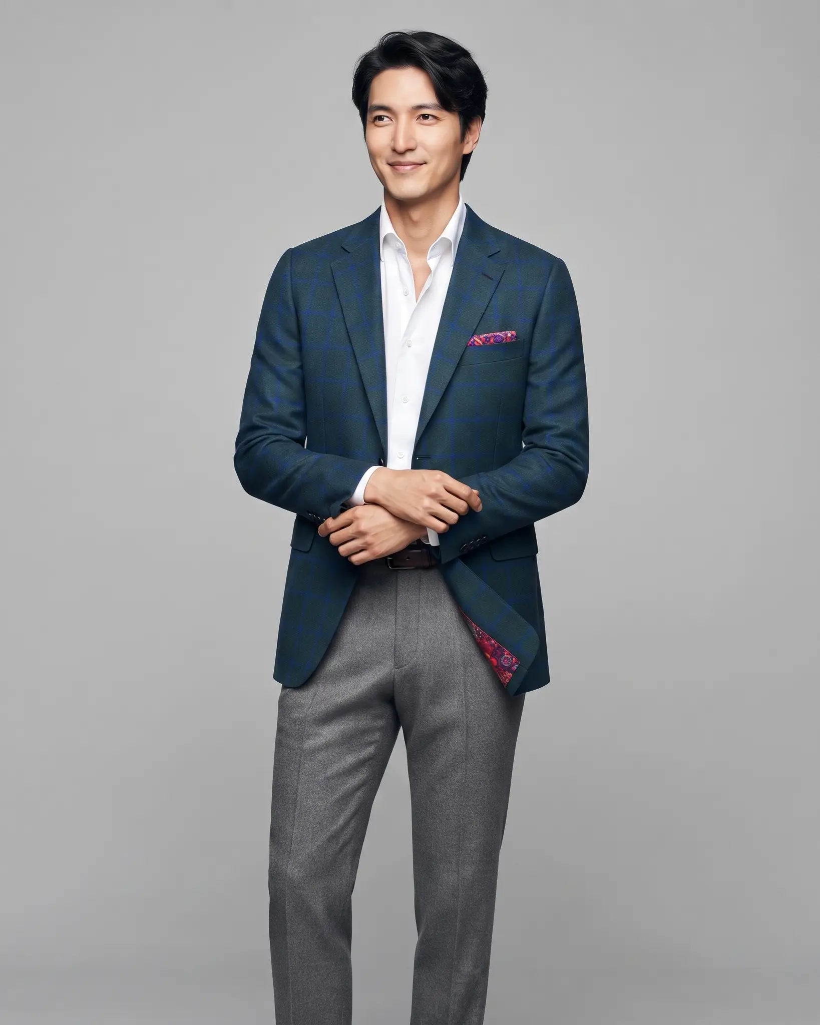 Angled model view of Deep Teal Green Windowpane men's sport coat showing natural drape and side facing editorial styling