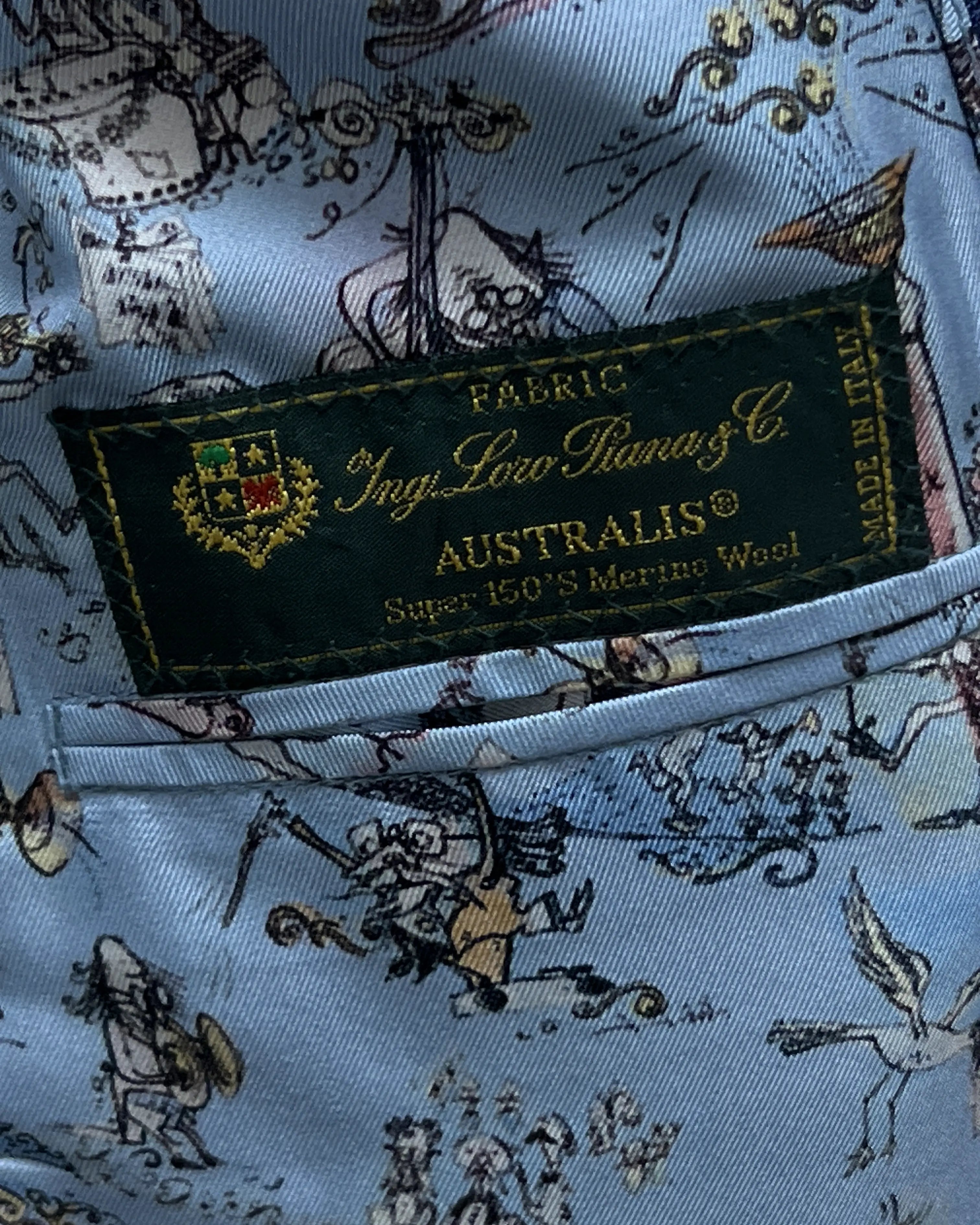Mill label detail of blue windowpane check men's suit showing Loro Piana label
