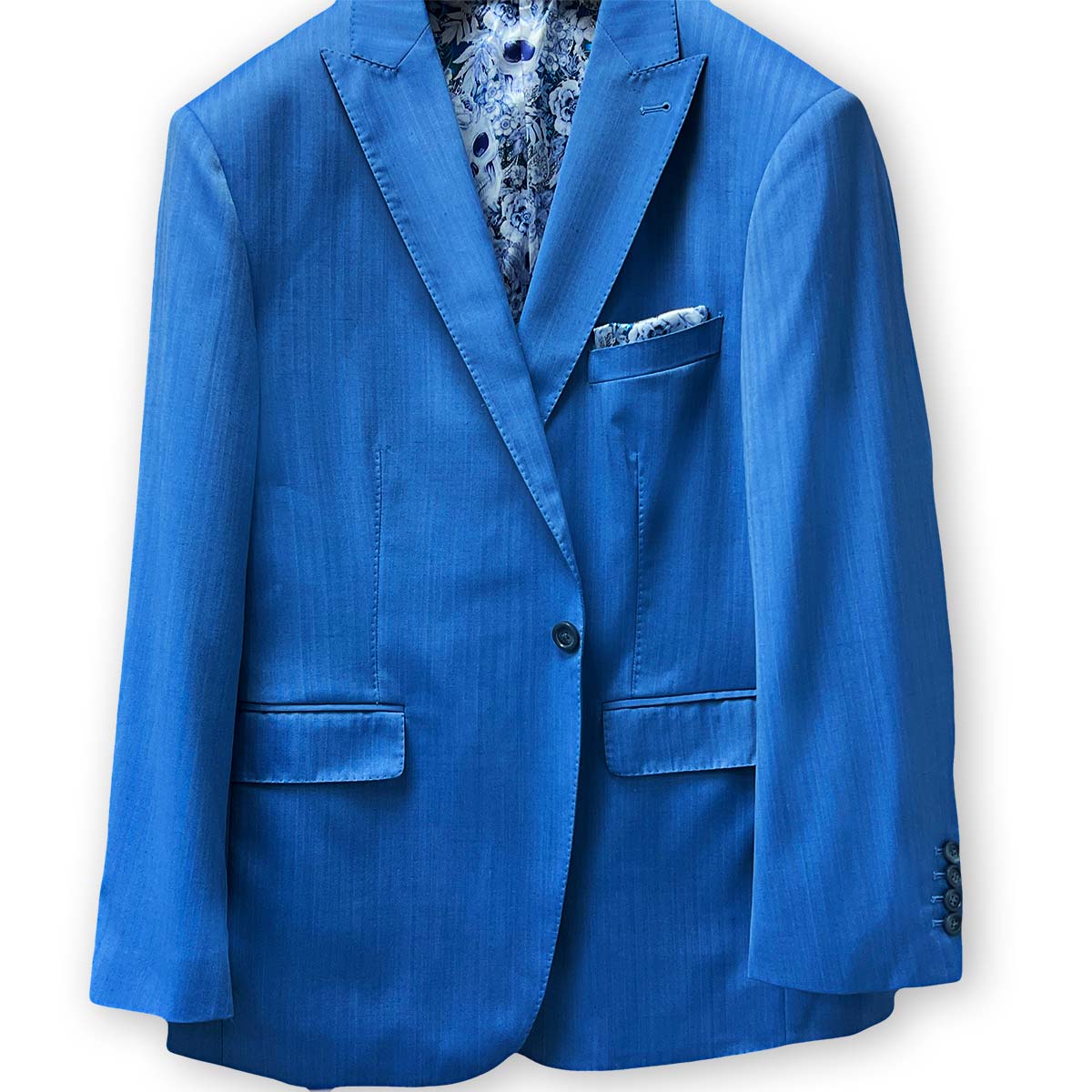 Men's blue herringbone suit tailored from 100% Australian Merino wool, available at Men's Wearhouse near you.