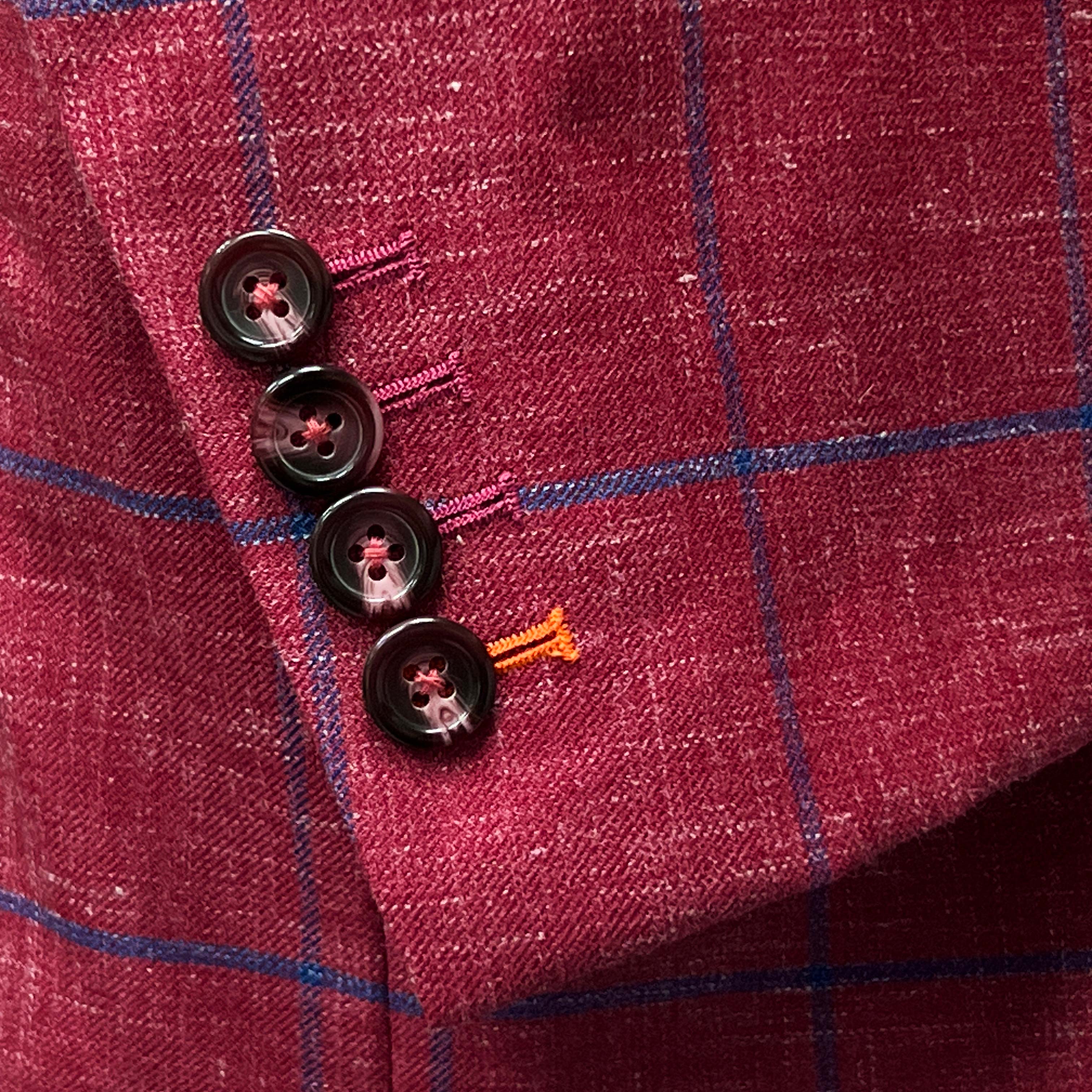 Men's suit style 2023 - rust maroon sportcoat with distinct royal blue windowpane.