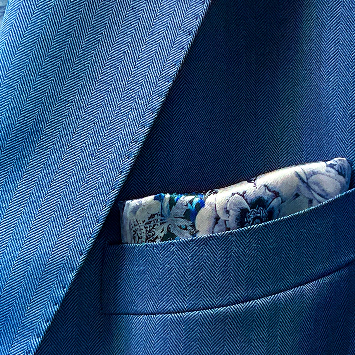 100% Australian Merino wool suit in a blue herringbone pattern, available at Men's Wearhouse.
