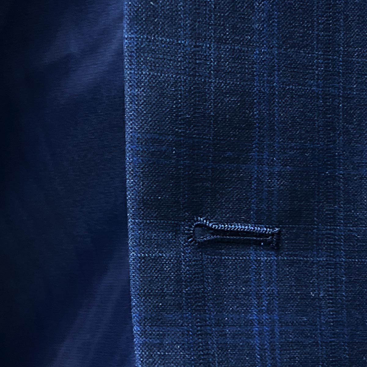 Buttonhole close-up, windowpane.