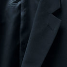 Notch lapel adding a timeless appeal to a classic black men's suit.