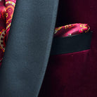 Pocket square accent on a burgundy velvet dinner jacket.
