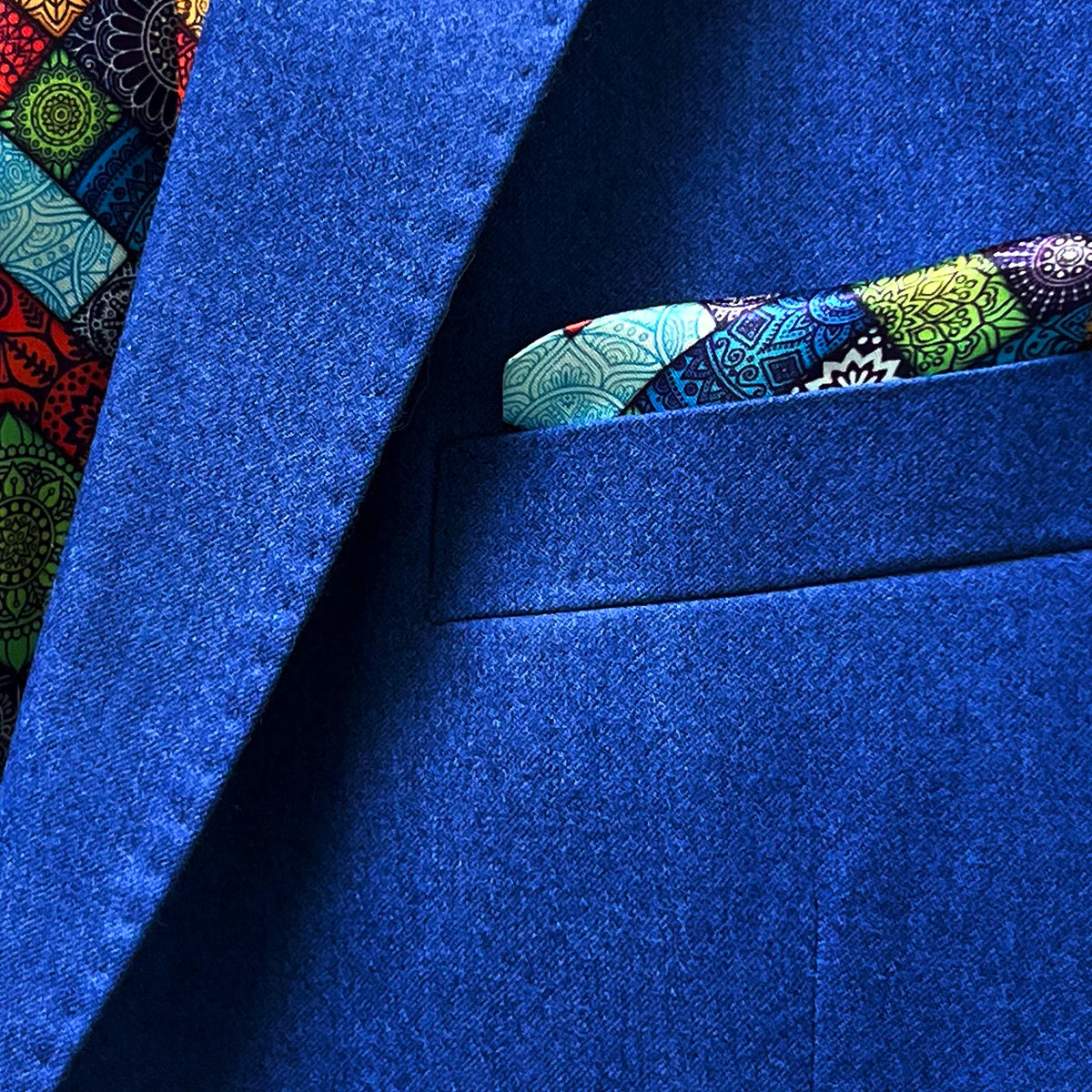 Pocket square accent on a light blue flannel suit for men.