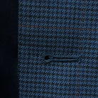 Detailed view of the buttonhole stitching on the prussian blue suit jacket, showcasing the quality and durability.