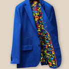 Inside view of the left side of the sapphire blue men's suit, featuring the detailed pocket and colorful lining.