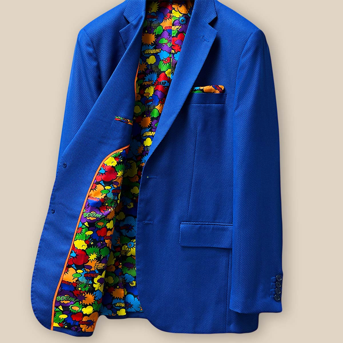 Inside view of the right side of the sapphire blue men's suit, showing the intricate details and vibrant lining.