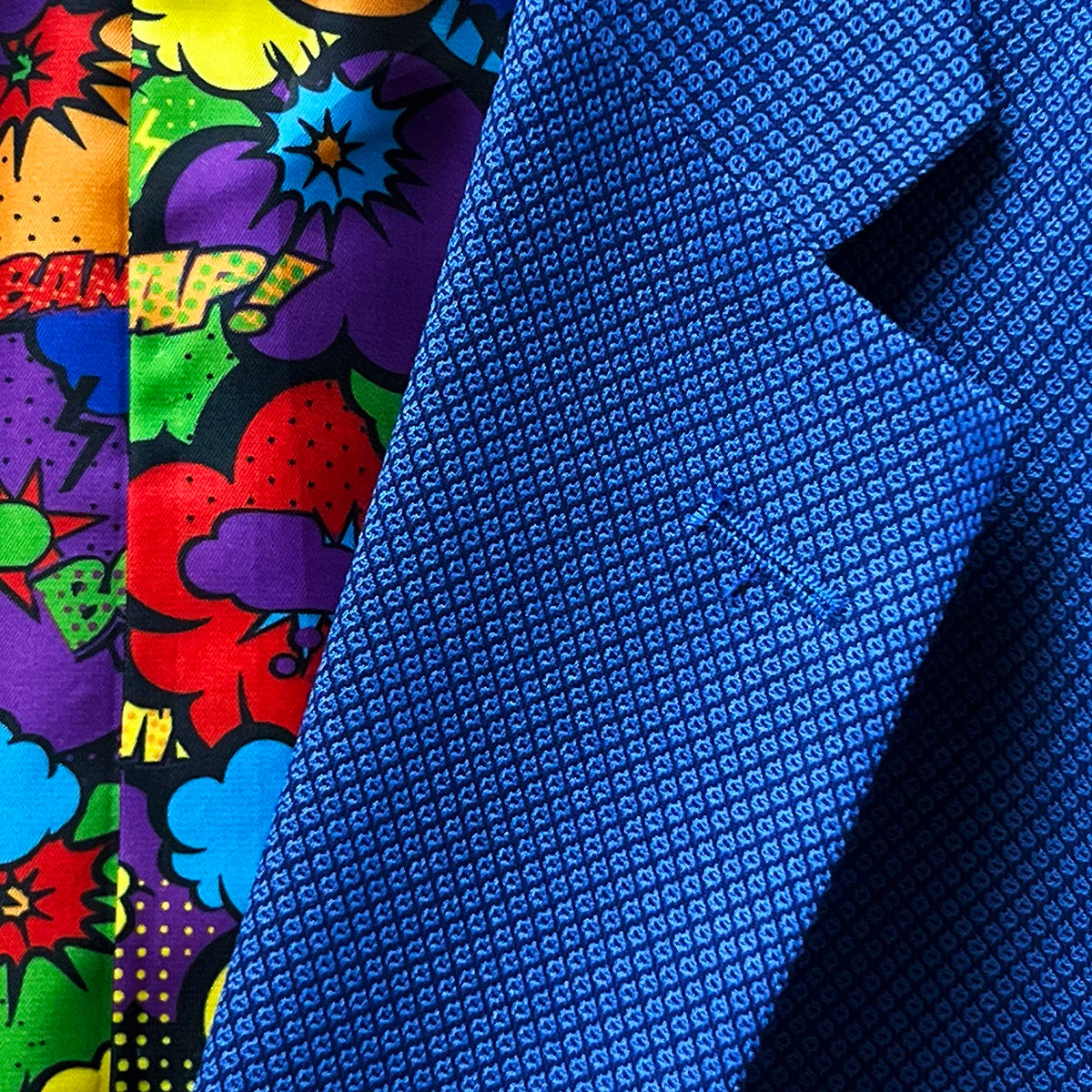 Detailed shot of the notch lapel style on the sapphire blue Westwood Hart men's suit, exemplifying classic tailoring.