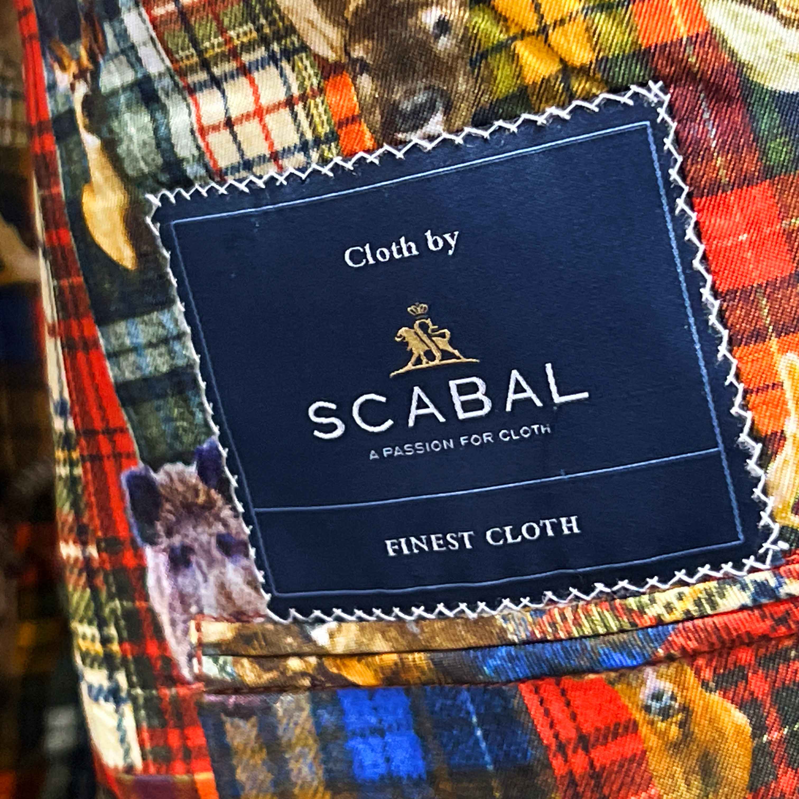 Full ensemble shot of Scabal deep blue navy emerald green overcheck mens suit with styling accessories