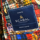 Full ensemble shot of Scabal deep blue navy emerald green overcheck mens suit with styling accessories