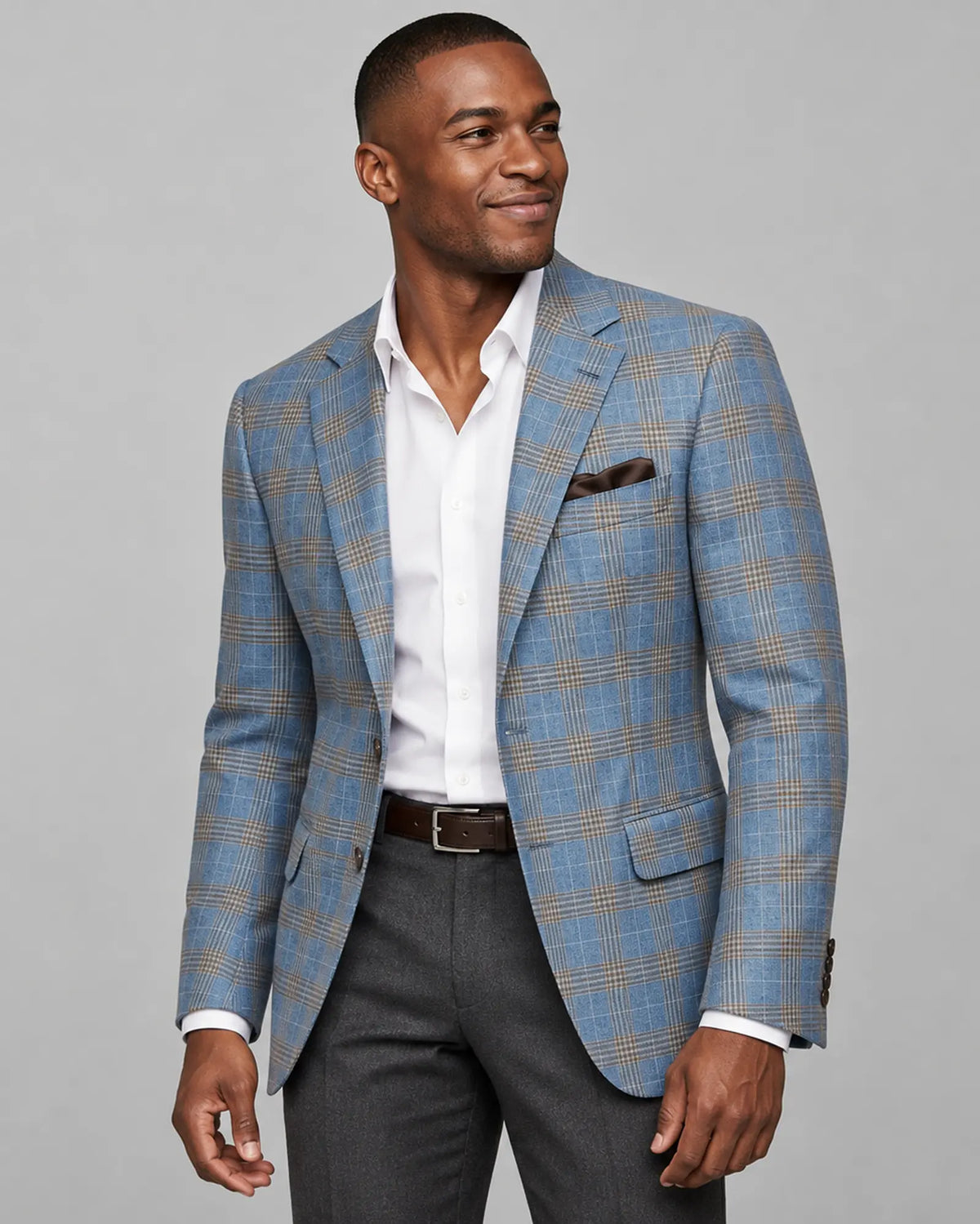 Alternate model side view of light blue with tobacco brown glen check men's sport coat showing a natural lining glimpse