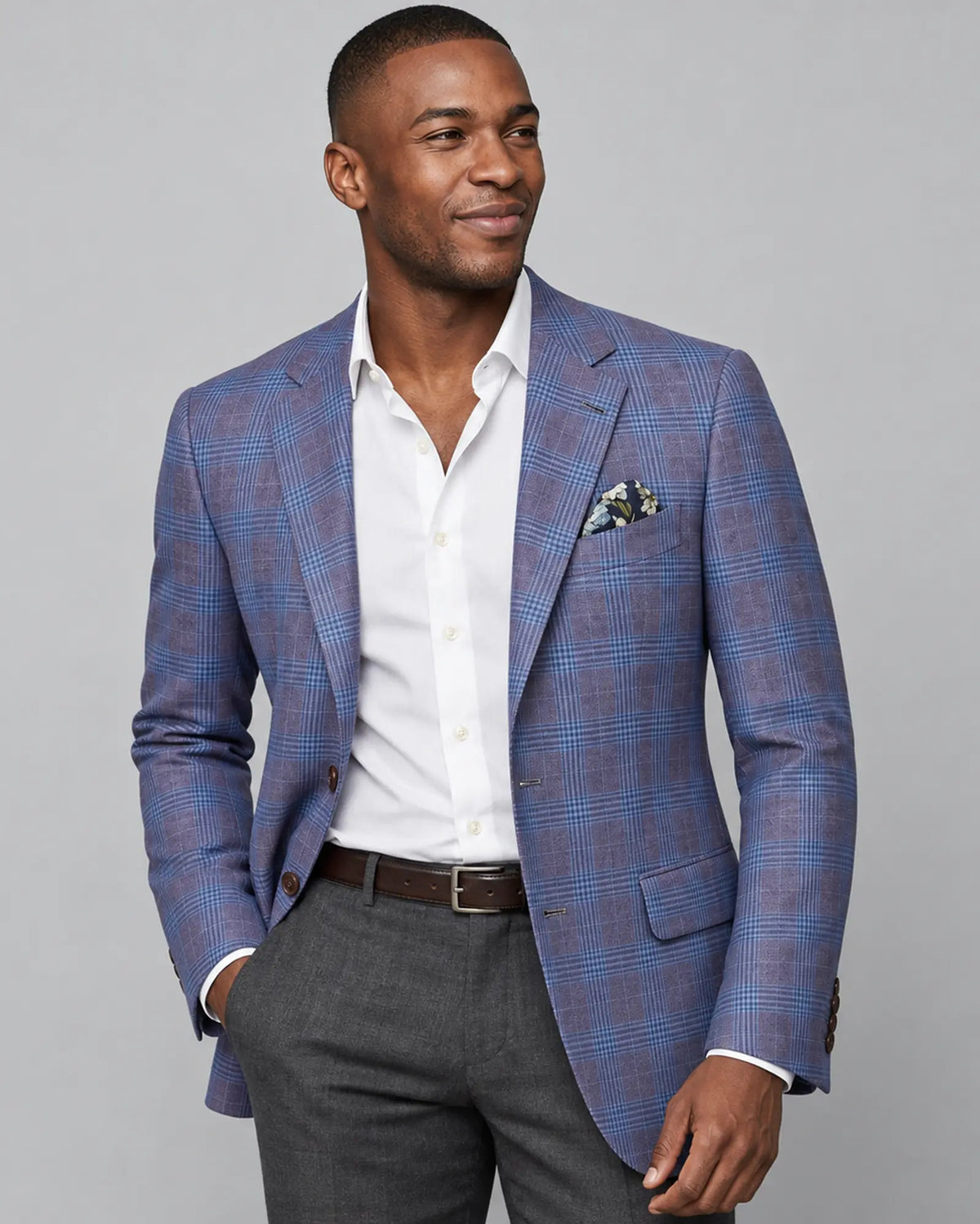 Side angle model view of lilac mauve with cornflower blue Glen plaid men's sport coat showing the side profile styling