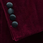 sleeve buttons on a burgundy velvet formal jacket.